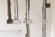 Electrical wiring conduits installed in wall